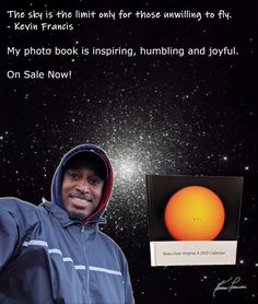 a man is holding up an orange object in front of the sky with stars behind him