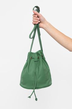 The Drawstring Bucket Bag is a classic that combines style and function. You’ll find that this spacious bag fits easily into your daily wardrobe. This artisanal product is made of genuine leather. All scars are characteristics of the skin and not imperfections. We hope you enjoy this unique handmade object. | Drawstring Bucket Bag for Women in Ivy Bucket Bag Style, Drawstring Bucket Bag, Bag For Women, Drawstring Bag, Bucket Bag, Ivy, Fashion Bags, Women's Accessories, Bag Accessories