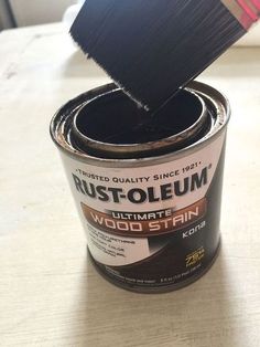 a can of rust oleeum is being used to paint