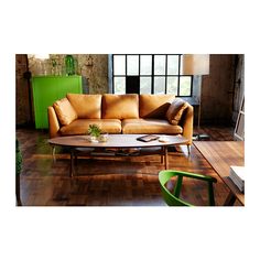 a couch and table in a room with wooden floors