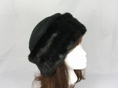 "I made this beautiful rich black hat out of mink faux fur and black fleece. The brim is a generous 4 1/2 inch frame of rich black mink faux fur and the hat is lined with black fleece for warmth and comfort. Sized to fit most adults 21.5\"-23\" around head. The hat is a comfortable fit on my 22 1/2\" head. Spot clean or dry. Handmade in Albany, Oregon by me!" Black Faux Fur Hat With Faux Fur Trim, Black Hat With Faux Fur Lining, Black Fur Felt Cloche Hat With Wide Brim, Black Fur Felt Wide Brim Cloche Hat, Classic Black Fur Felt Cloche Hat, Black Wide Brim Fur Felt Cloche Hat, Black Wide Brim Cloche Hat In Fur Felt, Black Curved Brim Cloche Hat In Fur Felt, Black Fur Felt Cloche Hat With Short Brim