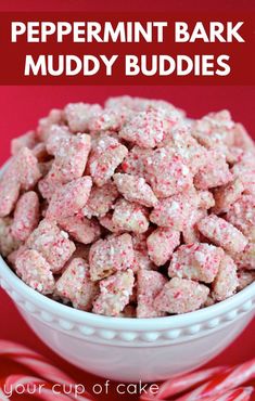 a white bowl filled with pink puppy chow