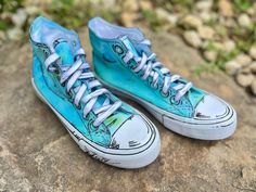 These size 7.5 women's high tops are hand painted with a tie dye of aqua blue and light green with a comic look. They're bright and fun.  WANT IT! WEAR IT! LOVE IT! Cell Shaded Shoes, Artistic Blue Sneakers With Round Toe, Artistic Blue Sneakers With Rubber Sole, Blue Hand-painted High-top Custom Sneakers, Hand Painted Blue Lace-up Custom Sneakers, Artistic Blue Low-top Custom Sneakers, Shoe Art Designs, Shoes Fun, Color Fits