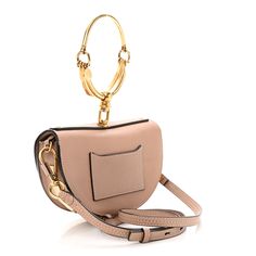 This is an authentic CHLOE Calfskin Small Nile Bracelet Minaudiere Bag Biscotti in Beige. This crossbody is crafted of fine calfskin leather in beige. The shoulder bag has a polished gold loop handle, an optional adjustable leather shoulder strap, and polished gold hardware. The flap opens to a beige leather interior with a patch pocket. Minaudiere Bag, Sequin Mini, Leather Interior, Blue Bags, Saddle Bags, Gold Hardware, Patch Pocket, Bucket Bag, Calf Skin