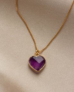 These hand-faceted heart gemstones remind us of a sweet treat. Wear this necklace and it just might spark up a conversation! Heart Cut Amethyst Jewelry For Gifts, Anniversary Amethyst Heart Necklace, Purple Heart Birthstone Necklace, Purple Heart-shaped Birthstone Necklace, Purple Faceted Necklaces As Gift, Elegant Heart-shaped Faceted Jewelry, Heart-shaped Gemstone Necklace As Gift For Her, Heart Shaped Gemstone Necklace As Gift For Her, Heart-shaped Crystal Gemstone Necklaces For Valentine's Day