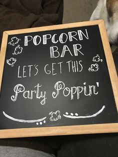 a sign that says popcorn bar let's get this party popin