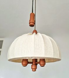 a light fixture hanging from the ceiling in a room