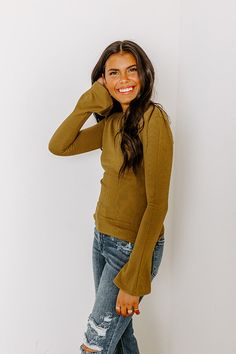 - Give your OOTD a touch of trendy flair with this cutie! - Unlined tight knit material with a ribbed texture - A round neckline - Long bell sleeves - A figure flattering silhouette that ends in a straight hemline Trendy Ribbed Long Sleeve Top For Spring, Chic Stretch Knit Top With Ribbed Neckline, Chic High Stretch Ribbed Tops, Solid Ribbed Stretch Long Sleeve Top, Spring Stretch Ribbed Knit Top, Stretch Knit Top With Ribbed Neckline, Chic Ribbed Stretch Tops, Chic Stretch Ribbed Tops, Chic Ribbed Long Sleeve Top With Stretch