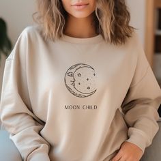 Moon Child Sweatshirt - Embrace Lunar Comfort Wrap yourself in the cozy embrace of our 'Moon Child' sweatshirt, designed for those who find solace in the moon's gentle glow. Crafted for comfort and adorned with celestial charm, this sweatshirt is perfect for stargazers, dreamers, and lunar lovers. Embrace the enchanting energy of the moon and let your inner magic shine bright, even on the chilliest nights. Whether you're moon bathing or simply daydreaming under the night sky, our 'Moon Child' sw Cotton Long Sleeve Tops With Moon Print, Long Sleeve Cotton Tops With Moon Print, Long Sleeve Cotton Top With Moon Print, Fall Cotton Top With Moon Print, Cotton Tops With Moon Print For Fall, Cotton Top With Moon Print For Fall, Divine Feminine Energy Aesthetic, Moon Bathing, Energy Aesthetic