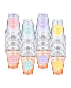 a stack of plastic cups with smiley faces on them