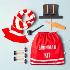 a red and white kit with accessories for skiing, snowboarding and skis on a blue background