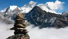 a stack of rocks sitting on top of a mountain