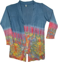 A stylish and attractive blue, stonewashed teal cover up or shrug with bohemian tie-dye - made of comfortable and smooth jersey knit cotton. The tie-dye is done only at the lower half of the shrug which gives it a unique look. You can team it with your favorite pair of jeans or shorts or even throw it over your bikini! Perfect for a beach camping evening. It only comes in one size and fits a small to a large. You'll feel a new sense of freedom in this versatile long shrug. Length: 29 - 33" Bust: Fitted Bohemian Blue Cover-up, Bohemian Hand Dyed Long Sleeve Tops, Casual Tie Dye Spring Cover-up, Blue Hand Dyed Bohemian Tops, Hand Dyed Blue Bohemian Tops, Bohemian Hand-dyed Blue Tops, Blue Bohemian Hand Dyed Top, Multicolor Bohemian Cotton Cover-up, Bohemian Multicolor Cotton Cover-up