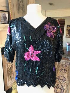 "Beaded sequin blouse,PM,Petite Medium,Black,Pink,Purple,scalloped Really pretty beaded blouse. Black sequin with pink and purple flowers Beaded around the edges Scalloped edges Bust 40\" Length 22\" Excellent condition BL238-hs Beaded sequin blouse,PM,Petite Medium,Black,Pink,Purple,scalloped" Rose Violette, Sequin Blouse, Beaded Blouse, Pink And Purple Flowers, Needle Minders, Paper Pattern, Scalloped Edges, Craft Organization, Creative Arts