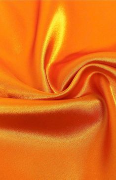 INFORMATION: This beautiful Stretch Charmeuse Sayin Fabric has a beautiful smooth shiny satin side with a modest matte finish on the back. The fabric is tightly woven and has a light 2-way vertical stretch, making it extremely durable. In addition, our stretch charmeuse is approximately 7 ounces per linear yard which is a better construction than most standard stretch charmeuse fabrics. This heavier gsm (grams per square meter) gives the fabric a richer feeling and a better hold when draping. Th Orange Fits, Couture Gown, Orange Satin, Orange You Glad, Shiny Fabric, Net Fabric, Orange Fabric, Couture Gowns, Square Meter