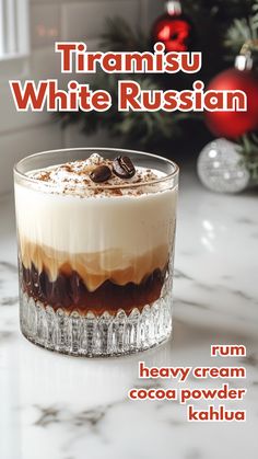 there is a dessert in the glass on the table with christmas decorations behind it and text that reads, tiamisu white russian