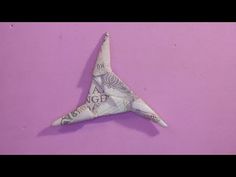 an origami bird made out of money on a purple background with the words i love you written in it