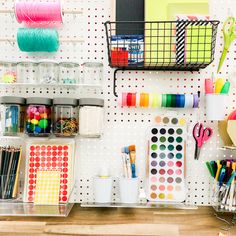 a pegboard with lots of craft supplies on it