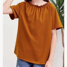 Saudacdn Girls Short Sleeve Ribbed Shirts Casual Knit Loose Round Neck Tee Ruffle T Shirt A-Brown Approximately: Chest (Pit To Pit In Back): 17” Length (Base Of Collar To Bottom Of Hem): 22 1/2” Trendy Orange Cotton Blouse, Casual Orange Cotton Blouse, Cute Brown Summer T-shirt, Ruffle T Shirt, Ribbed Shirt, Round Neck Tees, Girls T Shirt, Brown Orange, Girl Top