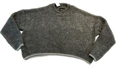 Elevate your casual style with this trendy Urban Outfitters gray cropped oversized sweater. The metallic silver trim adds a touch of sophistication to the relaxed fit pullover. It's perfect for travel, holidays, or any casual occasion. Crafted from 66% acrylic and 33% polyester, this sweater is lightweight and stretchy, providing both comfort and style. The fabric type is shearling, and the sweater features long sleeves, a round neckline, and solid pattern. It's available in size S and comes wit Urban Outfitters Crew Neck Winter Sweater, Urban Outfitters Crew Neck Sweater For Winter, Urban Outfitters Sweater For Winter Layering, Urban Outfitters Casual Sweater For Layering, Free Dogs, Oversized Sweater, Dog Friendly, Solid Pattern, Round Neckline