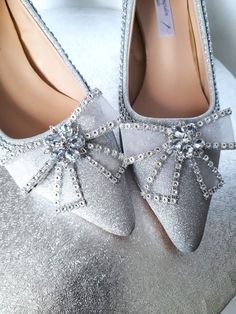 Introducing our exquisite Silver Bridal Shoes With Bow, the perfect addition to complete your wedding day ensemble. These enchanting wedding low heel shoes are not only stunning, but also comfortable enough for you to dance the night away. The silver color exudes elegance and the delicate bow detail adds a touch of femininity. Whether you're the bride or a bridesmaid, these shoes are sure to make a statement on your special day. Don't compromise on style or comfort - these Silver Bridal Shoes With Bow are the perfect choice for any wedding celebration. Heel Height: 5cm Closure Type: slip-on Colour: silver Fit: 1) If your feet are narrow and thin,please choose 1 size smaller than usual 2) If your feet are wide,please choose one size bigger than normal The correct posture must be taken when Elegant Silver Court Shoes For Evening, Glamorous Flat Heel Wedding Shoes For Prom, Low Heel Wedding Shoes With Rhinestones, Low Heel Rhinestone Wedding Heels, Silver Closed Toe Kitten Heels For Formal Occasions, Silver Flat Heel Wedding Shoes For Party, Elegant Flat Wedding Shoes With Rhinestones, Elegant Silver Kitten Heels With Round Toe, Elegant Flat Wedding Shoes For Evening