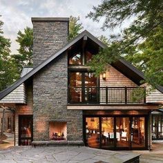 a large house with a fireplace in the middle of it