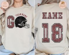 Custom Football Sweatshirt,Football Name and Number Sweater, Personalized Football Sweater,Game Day Football Sweater,Custom Football Hoodie HOW TO ORDER: 👕 Select your size in the drop-down menu. 👕 Select your size in the drop-down menu. 🛒 Click Add to Cart, then choose your shipping option.  SIZING: 📏 All sweatshirts and t-shirts are unisex, classic fit. Please refer to the size chart in the listing photos for details. 👕 Easy measuring tip: Take your favorite shirt, lay it on a flat surface, and measure the width (armpit to armpit) and length (top to bottom). ⚠️ Sweatshirts and t-shirts are pre-shrunk but may shrink slightly after washing. SHIPPING: 🚚 We have the fastest handmade Production time! Most items ship within 1 days (see each listing's "Estimated arrival" section for more Football Season Hoodie With Team Name For Sports Events, Football Season Hoodie With Team Name, Team Spirit Hoodie With Team Name For Football Season, Football Season Sports Hoodie With Team Name, Team-colored Hoodie For Football Season, White Hoodie For Game Day, Football Season, White Hoodie For Game Day During Football Season, White Hoodie For Football Season Game Day, Winter Team Spirit Sweatshirt For Team Events