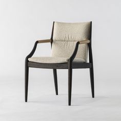 an upholstered chair with armrests and seat cushion in black wood, against a white background