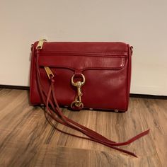 Rebecca Minkoff Mini Mac Crossbody Bag In Red With Gold Hardware. This Bag Is In Excellent Condition Despite Some Minor Flaws Which Are Included In The Pictures. The Zipper For The Front Pocket Is Slightly Cracked But Not Very Noticeable. Other Than That The Bag Looks Amazing! This Bag Has Only Been Worn A Few Times. Interior Is Black And The Bag Comes With A Detachable Shoulder/Crossbody Strap. Stored In A Dust Bag In A Smoke-Free Home. Rebecca Minkoff Mini Mac, Mini Mac, Rebecca Minkoff Mac, Crossbody Strap, Rebecca Minkoff, Gold Hardware, Front Pocket, Crossbody Bag, Dust Bag