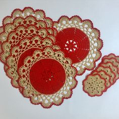 crocheted doily and coasters on white surface