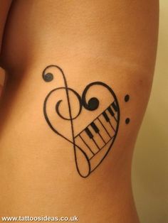 a heart with musical notes on it and a treble in the shape of a piano