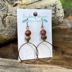 Light and airy hoop earrings are the perfect compliment to your festival style. Hand formed hoops are made with tarnish resistant enameled copper wire in vintage bronze. Accented with a pair of warm and earthy jasper. - Lightweight earrings for everyday wear! - Wire is manufactured in the USA - Earrings dangle 2" long on antiqued gold plated steel wires. Bohemian Brown Wire Wrapped Hoop Earrings, Bohemian Small Hoop Copper Earrings, Bohemian Small Copper Hoop Earrings, Small Bohemian Copper Hoop Earrings, Bronze Wire Wrapped Hoop Earrings, Bohemian Wire Wrapped Hoop Earrings For Everyday, Minimalist Brown Hoop Earrings For Gift, Bohemian Wire Wrapped Hoop Earrings, Unique Small Hoop Copper Earrings