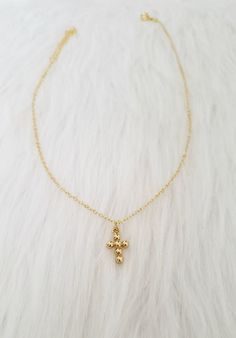 "Gold plated necklace with cross charm! The cable chain is gold plated over stainless steel and the gold beaded cross charm is gold plated over brass! You will love this beautiful necklace perfect to layer with other dainty pieces! If you need any other chain length or style please let us know! MEASURES: 16\" + 2\" ----------------------------- ● All products are shipped in transparent plastic bags in a kraft box ● Some products can be customized. Write us a message for any request! ● We send packets from US. All orders are shipped with first class mail Don't forget to read the shop policies and for any other information or question don't hesitate to contact us! Thanks for visiting our shop! -Vic and Madeleine" Gold Dainty Cross Necklace With Adjustable Chain, 14k Gold Filled Cross Necklace With Delicate Chain, Dainty Gold Cross Pendant Necklace, Dainty Gold Crucifix Necklace, Dainty Gold Cross Chain Necklace, Dainty Gold Crucifix Cross Necklace, Gold Crucifix Cross Necklace With Delicate Chain, 14k Gold Filled Cross Necklace, Dainty 14k Gold-filled Cross Necklace