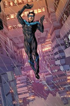 a man flying through the air while wearing a black suit and blue mask with buildings in the background