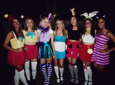 a group of women dressed up in costumes