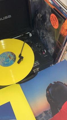 a record player and some records on a table