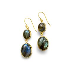 These stunning two-drop earrings feature natural labradorite stones, each with unique variations that make every pair one-of-a-kind. The handmade bezel setting enhances the natural beauty of the stones, which catch the light with subtle flashes of blue and green. With neutral hues, these earrings easily complement any outfit. The French hook design ensures a comfortable fit, and the 1.5" length adds a touch of understated sophistication. Labradorite Earrings, Hook Design, Labradorite Stone, The Natural, Blue And Green, Bezel Setting, The Light, Labradorite, Natural Beauty