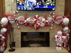 a fireplace decorated for christmas with decorations