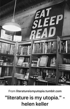 the eat sleep read sign is hanging from the ceiling in front of bookshelves