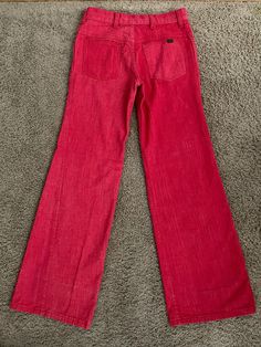 "Vintage Women's 70's Red, Low Rise, Bell Bottom, Jeans by Cheap Jeans (S) 1378 These Ladies jeans come in red colored denim and are low waisted, with two front pockets with two back pockets with a bell bottom leg shape. The denim is soft like a pant and does not stretch. Cotton/Polyester Blend *These pants are slightly too small for the mannequin and the zipper works properly. *If shipped within the US, this will go Priority Mail for a quick delivery! Size: (S) Modern Day 2 Waist: 28\" Hips: 32 Red Mid-rise Flare Jeans In Denim, Red Cotton Jeans With Pockets, Retro Mid-rise Cotton Flare Jeans, Casual Red High Rise Flare Jeans, Red Mid-rise Jeans With Five Pockets, Retro Red Wide Leg Jeans, Red Wide Leg Cotton Jeans, Red Mid-rise Jeans, Red Retro Denim Bottoms