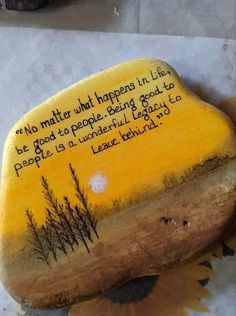 a painted rock with a poem written on it