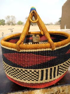 a woven basket sitting on top of a table