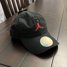 Brand New With Tags. Authentic Item. Hook And Loop Closure On Tie Back. Trendy Black Dad Hat For Outdoor, Trendy Black Dad Hat For Sports, Casual Red Hat With Adjustable Fit, Jordan Hats, Jordan Boys, Red Jordans, Jordan Grey, Flat Brim Hat, Black Snapback