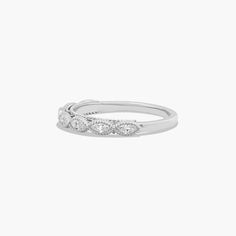 a white gold ring with three diamonds