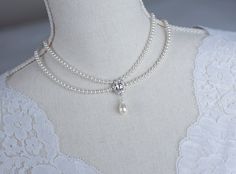 Vintage, Romantic Style White CZ  Necklace, Victorian Wedding Pearl and White CZ Bridal Choker,  Romantic Multi Row Vintage Swarovski Pearl  Materials used: - White/Ivory Cream Swarovski pearls - cubic zirconia stones - rhodium plated over brass The necklace will arrive packaged ready for gift giving in a delicate white jewelry box with a silver ribbon. Matching earrings for this necklace:  Back to my shop http://www.etsy.com/shop/crinadesign73 Thank you for visiting my store! Elegant Pearl White Wedding Choker, Vintage Pearl White Bridal Necklace, Pearl White Wedding Choker With Pearl Charm, White Victorian Pearl Necklace, Luxury Pearl White Vintage Necklace, Sewing Wedding Dress, Victorian Necklace, White Jewelry Box, Bridal Choker