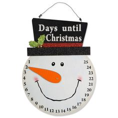 a clock with a snowman face on it's face and the words days until christmas