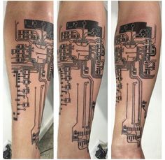 the arm is covered in circuit board tattoos