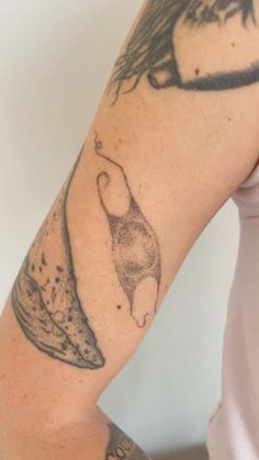 a woman with a tattoo on her arm