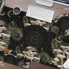 a mouse pad with an image of mushrooms and stars in the background on a desk