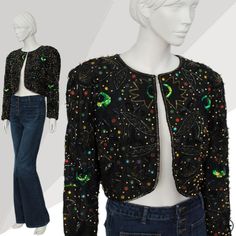 "Welcome to AT, How stunning is this piece! 100% silk and 1980s made, the bolero/cropped jacket is completely adorned with sequins, beads and gems. Set with a black base, the fully lined long sleeved bolero/jacket features lots of intricate beaded and sequined floral,  feather and other shape designs. For example, there looks to be tiny seed beads and vibrant green iridescent sequins which come together in a peacock feather formation. When the opening of the piece is closed - the beadwork and se Vintage Fitted Outerwear For Festive Occasions, Vintage Outerwear For Night Out In Spring, Vintage Festive Party Outerwear, Festive Vintage Party Outerwear, Stretch Clothes, Simple Black Dress, Sequin Jacket, Peacock Design, Bolero Jacket